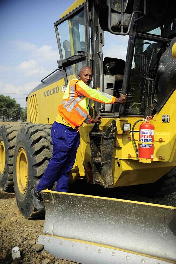 Former Sundowns star Papi Mbele now works at a tar road construction site