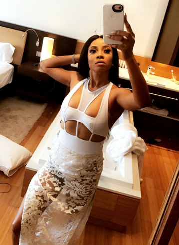 Photos: Toke Makinwa flashes her nipples in skimpy swimsuit
