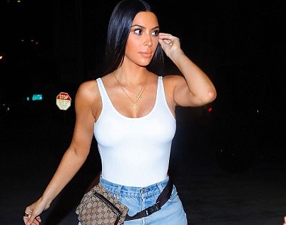 Photos: Kim Kardashian goes braless in white vest-top as she steps out for dinner in LA
