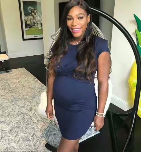 Serena Williams radiant as she flaunts her baby bump in a navy blue minidress